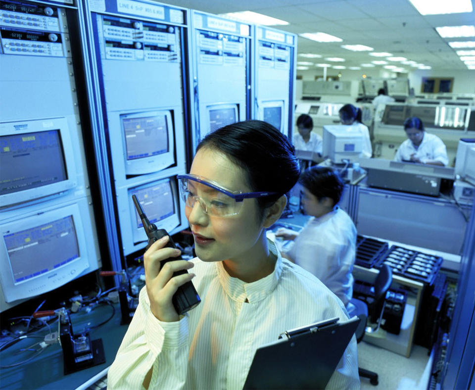 Motorola Inc. Commercial, Government and Industrial Solutions Sector (CGISS) photo of woman speaking on hand held device.