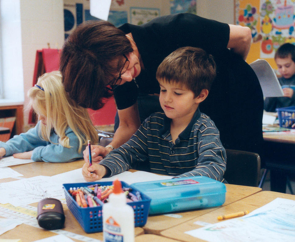Pearl River School District photo of teaher helping a student.
