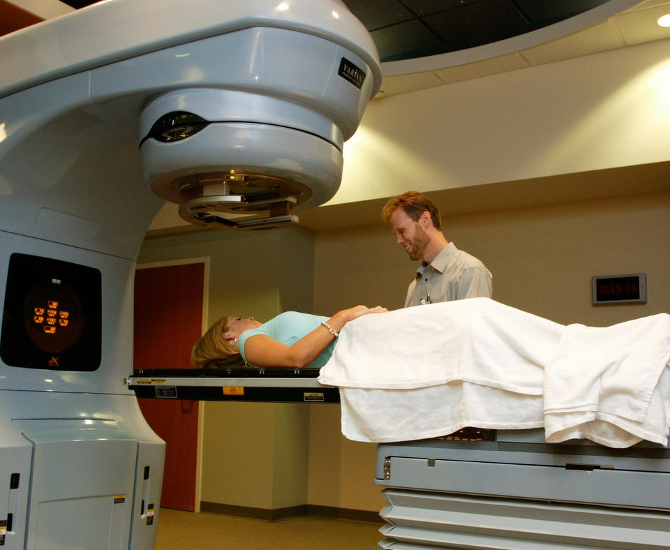 Schneck Medical Center photo of employee talking to a patient about a scan.