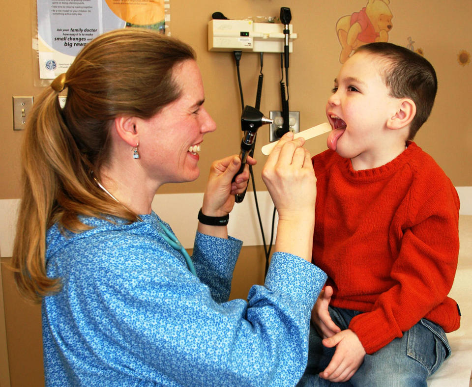 Southcentral Foundation photo fo doctor checking on sick child.