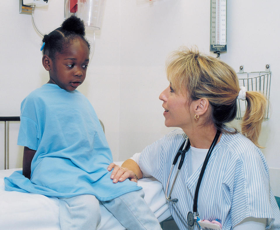 SSM Health Care photo of doctor checking on a patient.