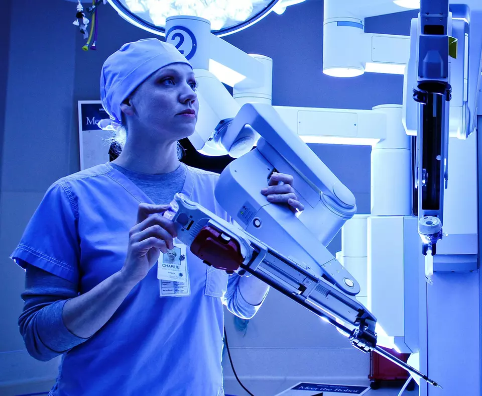 St. David’s HealthCare photo of employee using equipment in a hospital.