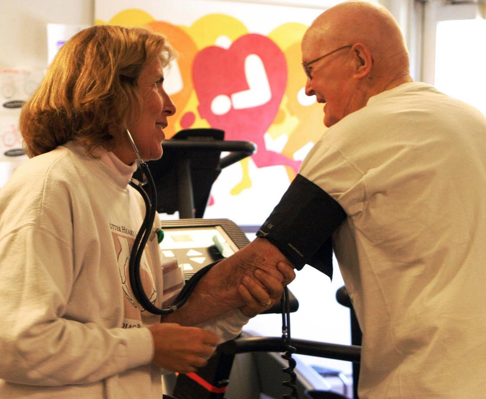 Sutter Davis Hospital photo of nurse taking blood pressure of patient.