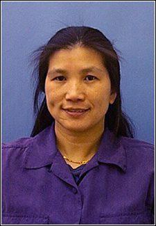 Li Piin Sung, a person with long black hair, smiles for the camera.