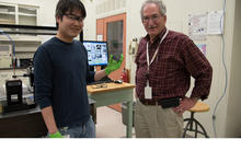 Two men standing in lab