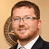 portait of a red-haired, bespectacled, bearded Caucasian man