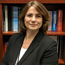 portrait of Katrice Lippa in front of a bookcase