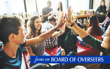 Focus on Overseers John Jansinski image of college students working in a study group doing a high five with their hands.