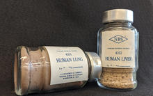a photo of two bottles about the size of spice bottles. On one is written 4351 Human lung for 239+240 Pu measurements, and on the other is written 4352 Human liver for 239+240 Pu measurements