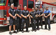 Emergency Services employees from the City of Germantown, TN standing in front of the fire truck at the station.