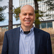 Apostol Vassilev poses outdoors for a head shot on the Gaithersburg campus.