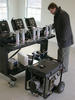 A NIST researcher adjusts a multi-gas analyzer which will measure carbon monoxide, oxygen, carbon dioxide and hydrocarbons concentrations produced by such a generator located, against safety advice, in a garage.