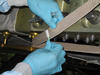 A technician swabs for microbes on a mockup of the interior of the International Space Station at NASA's Kennedy Space Center in Florida. 