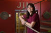 Deborah Jin standing on the staircase at JILA
