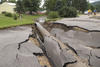 Photo of damage to a road caused by a 2007 flood in Minnesota