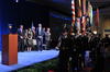 eaders of 2014 Baldrige Award recipient organizations and Commerce Department Deputy Secretary Bruce Andrews watch the procession of the United States Joint Service Color Guard during the Baldrige Award Ceremony on Sunday, April 12, 2015.