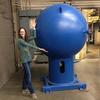 NIST researcher Jodie Pope with the big blue ball