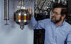 NIST researcher Mike Moldover with a basketball-sized metal sphere used to measure the speed of sound in a gas