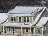 photo of the house in snow