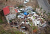 A home in the mountains of Puerto Rico lies in ruins as a result of the extreme force winds of Hurricane Maria.