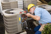 man working on heat pump unit