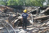 NIST researcher photographing the remains of the Sofa Super Store in Charleston, S.C., on June 19, 2007, the day after the fire that killed nine firefighters.