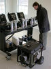 L researcher Steven Emmerich adjusts a multi-gas analyzer that will measure carbon monoxide, oxygen, carbon dioxide and hydrocarbons concentrations produced by such a generator located, against safety advice, in a garage.