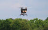 multi-bladed drone in flight