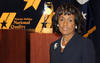 Photo of Jacqueline Calhoun at the Baldrige Award Ceremony with the Award crystal.