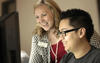 2018 Baldrige Award Recipient Tri County Tech photo showing a professor and a student working on a computer.