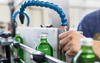 Water bottle small business filling green bottles with spring water.