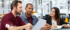 supervisor and employees having meeting in manufacturing facility