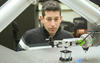 Brian Weiss overseeing his robot's operation
