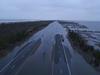 A flooded section of highway.