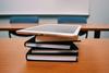 tablet and books on table