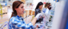 Female manuel workers team working on the production line in factory stock photo