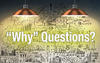 Overhead lights shining on the words "Why" Questions with sketches on charts in the background.
