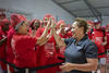 Jo Ann Jenkins high-fives a group of smiling people. 