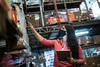 Woman wearing a mask checking inventory a manufacturing facility