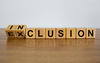 Blocks on a table spelling Inclusion.