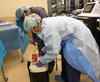 Mid-America Transplant employees preparing to send out a donor organ.
