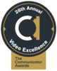 black circle. big white and gold lowercase a in the middle. Around the edges: 28th annual video excellence in white. Gold box at bottom that includes black words: The Communicator Awards