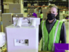 Manufacturing worker standing by equipment