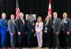 group photo taken at NCWM 2023 Annual Meeting; Craig VanBuren, Don Onwiler, and Mahesh Albuquerque of NCWM, Laurie Locascio and Katrice Lippa of NIST, Gene Robertson of NCWM, David Sefcik