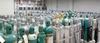 Photograph of hundreds of gas cylinders in a gas storage facility.