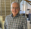 Antonio Possolo poses for a head shot in the NIST library.