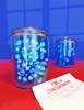 Illustration shows two clear jars full of marbles on a red table with a piece of paper that says “Find the Concentration.”
