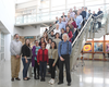 Staff gather, standing on the steps for a large group photo