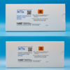 Two white cardboard boxes with white labels that contain blue text that reads  "Organic contaminants in smokers' urine"  One box displays Standard reference material 3672a and other 3673a