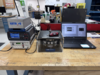 The photo shows the entire ENTR_v2 measurement setup that was recently deployed for field testing to Nellis Air Force Base. ENTR_v2 along with electronics and a laptop for controlling the system are depicted. A commercial red colored torque screwdriver is shown as an example of a tool which can be calibrated by ENTR.
